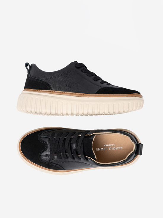Fekete színű bőrből készült sneaker bézs színű platformon