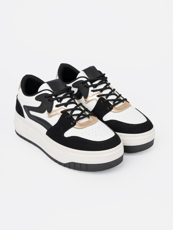 Fekete-fehér színű sneaker cipő aranyszínű részletekkel
