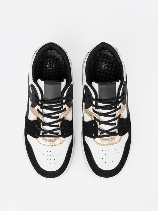 Fekete-fehér színű sneaker cipő aranyszínű részletekkel