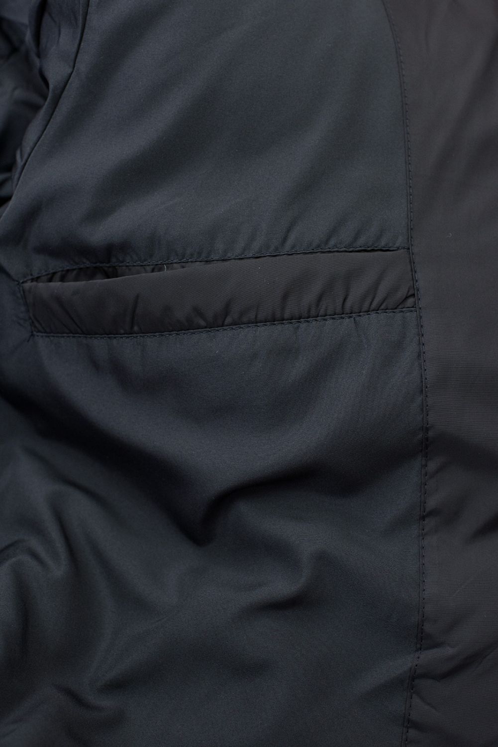 Sötétkék színű hosszú téli kabát műszőrmével