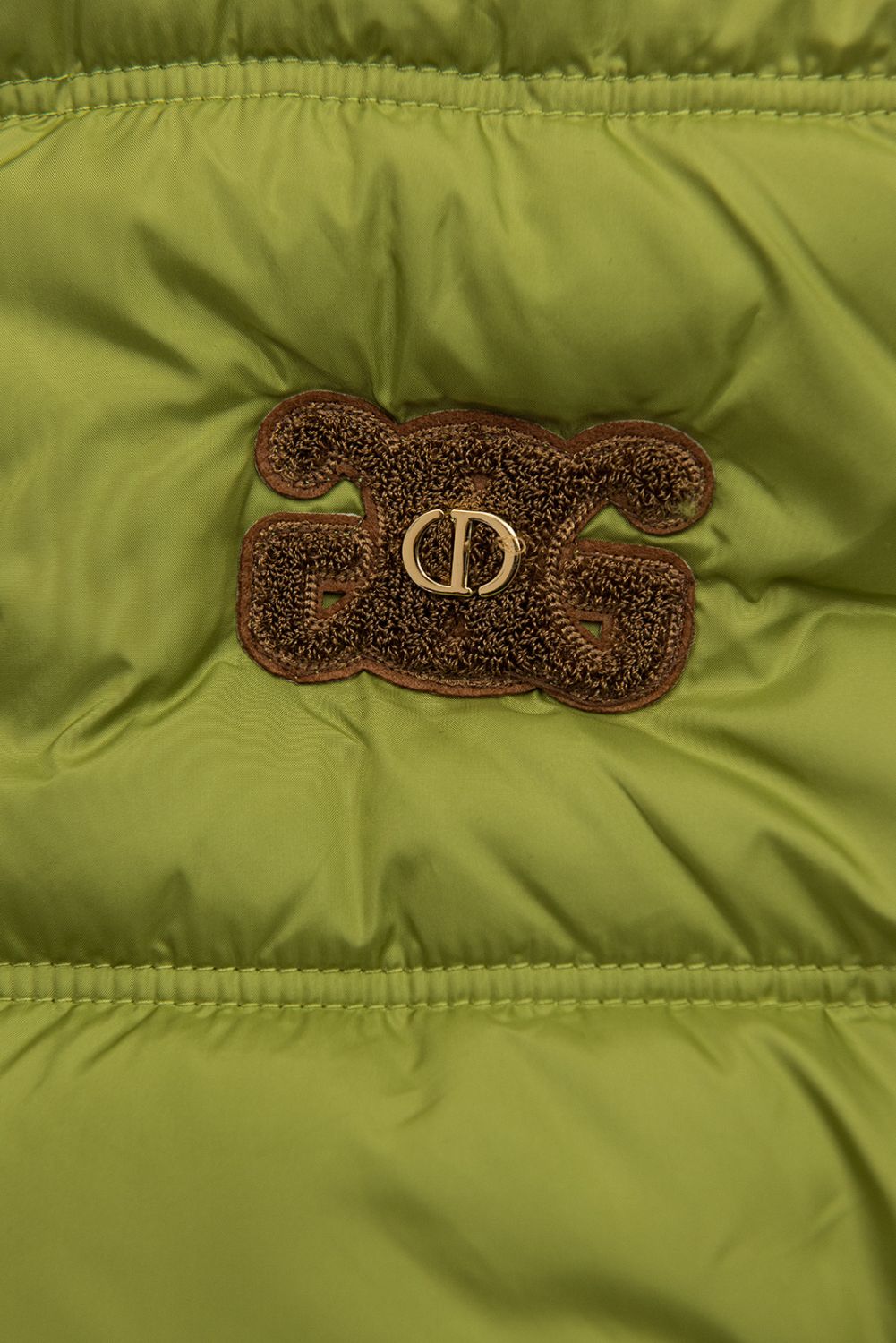 Zöld színű steppelt kapucnis mellény