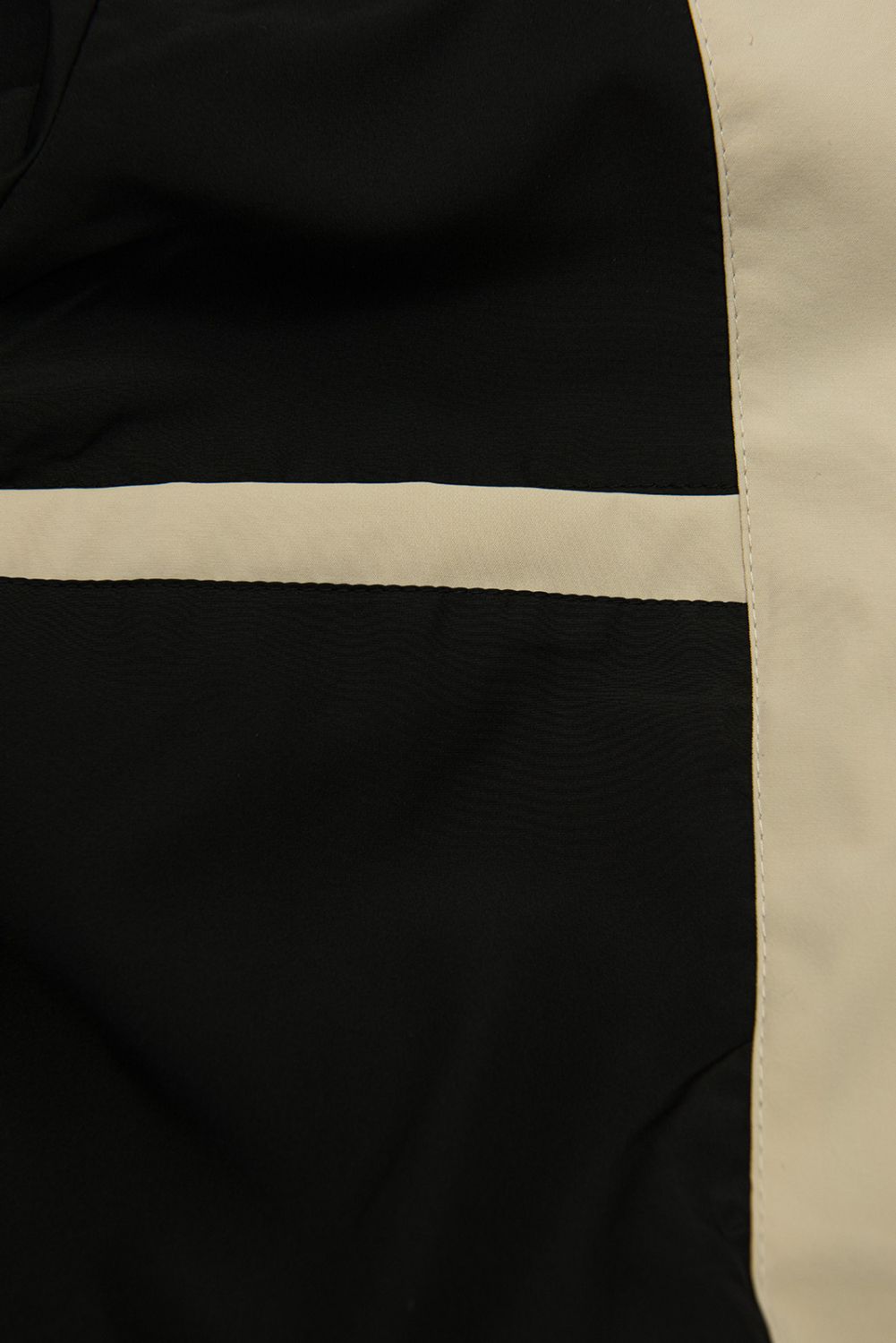 Bézs színű átmeneti parka derékban behúzással