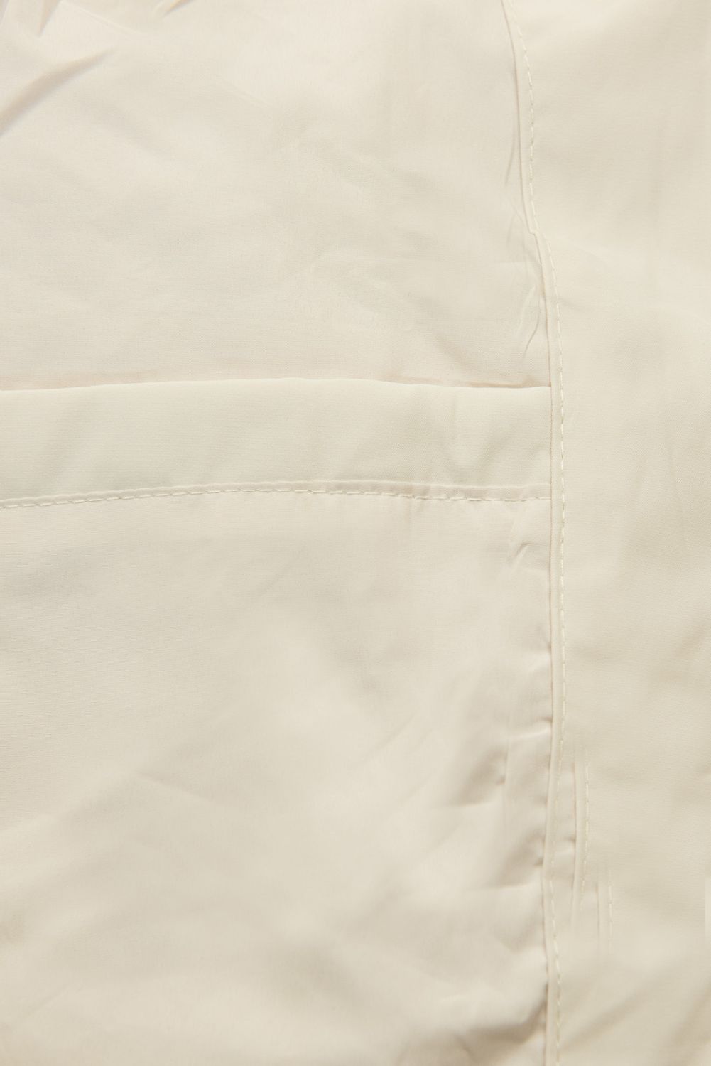 Ekrü színű tavaszi parka nagy kapucnival