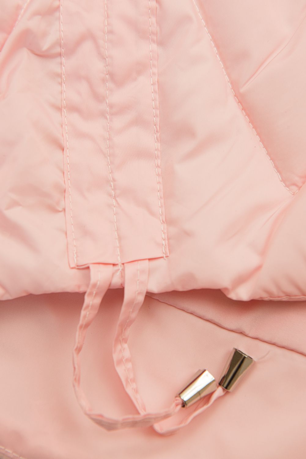 Világos rózsaszínű hosszított mellény