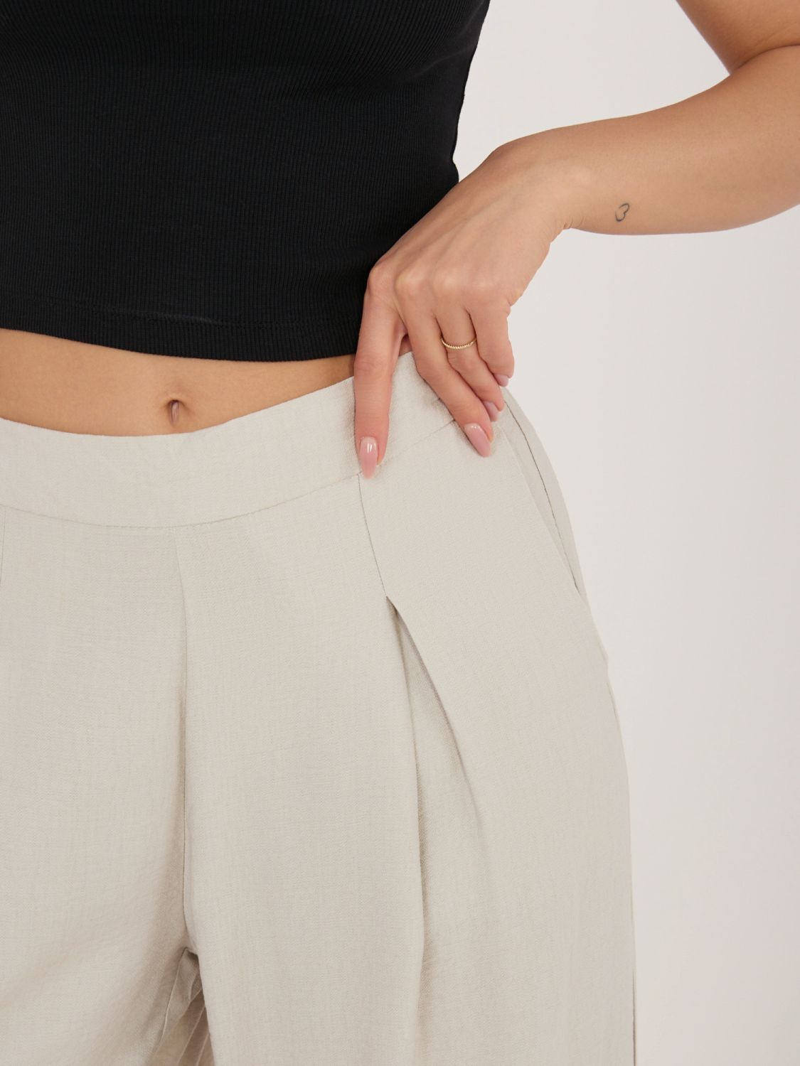 Bézs színű visszkózból készült palazzo nadrág