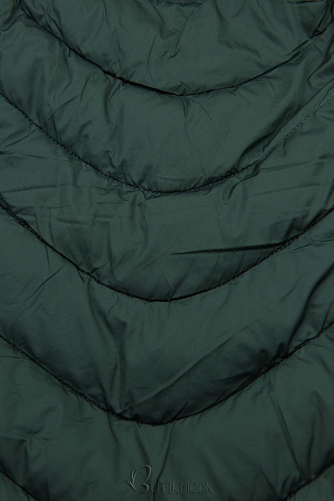 Sötétzöld színű steppelt kabát meleg plüss béléssel