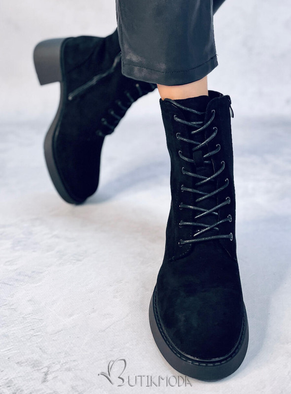 Fekete színű cipzárral és fűzővel ellátott cipő