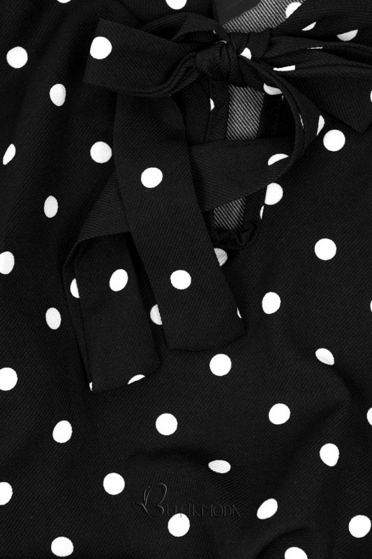 Fekete és fehér színű pöttyös ruha masnival