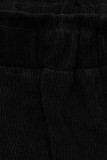 Fekete színű laza nadrág derekán gumival