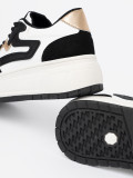 Fekete-fehér színű sneaker cipő aranyszínű részletekkel